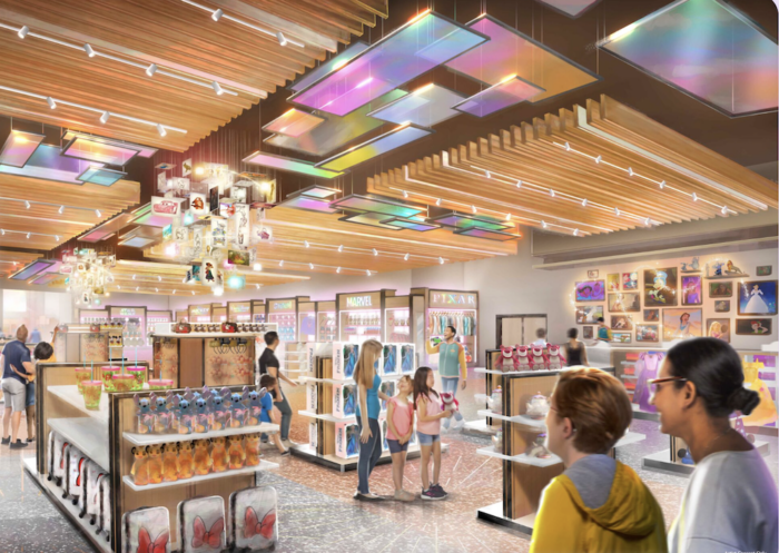 Dans un magasin de cosmétiques moderne et bien éclairé du Disney Village, avec des vitrines colorées et des poutres en bois au plafond, plusieurs clients parcourent divers produits de beauté.