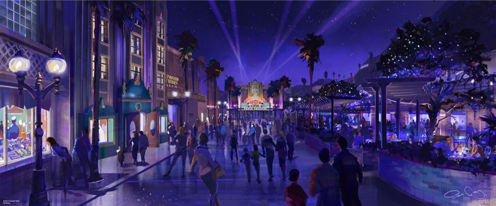 Ambiance nocturne à Disney Adventure World avec un spectacle de lumières au-dessus des attractions